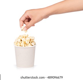 hand holding popcorn by a cup isolated on white background