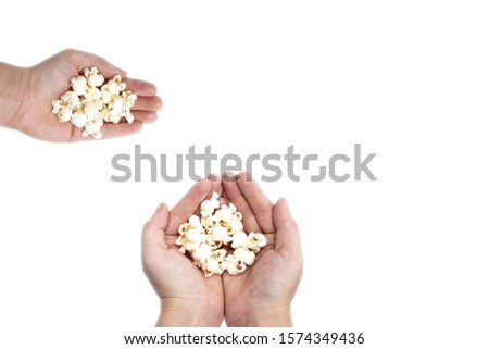 Similar – woman with popcorn in hand on yellow background. Copyspace