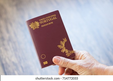 Hand holding Portuguese passport