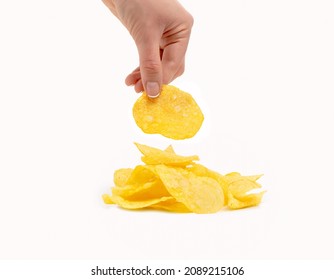 Hand Holding Potato Chips Isolated On A White Background