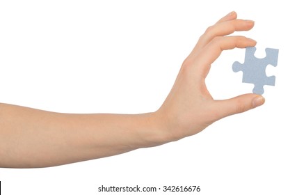 Hand Holding Puzzle Piece On Isolated White Background