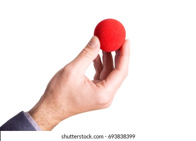 Hand Holding A Red Ball