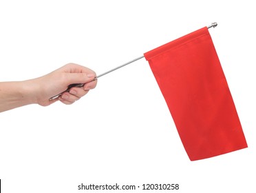 Hand Holding A Red Flag Isolated On White Background. Put Your Own Text