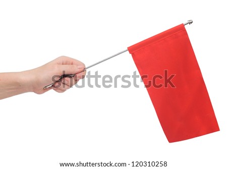 Hand holding a red flag isolated on white background. Put your own text