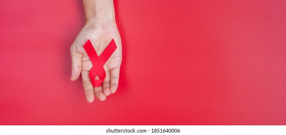 Hand Holding Red Ribbon Supporting People库存照片1851640006 Shutterstock