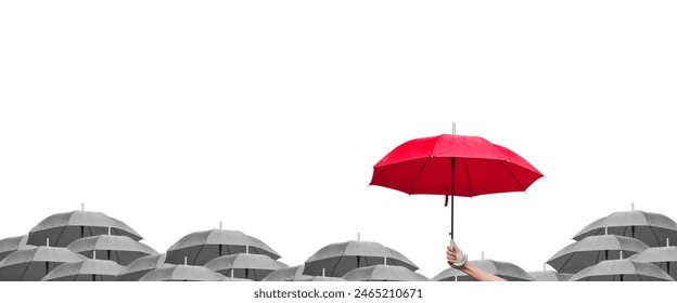 Hand holding red umbrella over group of dark umbrellas . Leadership concept. Panorama image. - Powered by Shutterstock