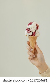 Hand Holding Red Velvet Ice Cream Cone