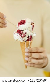 Hand Holding Red Velvet Ice Cream Cone