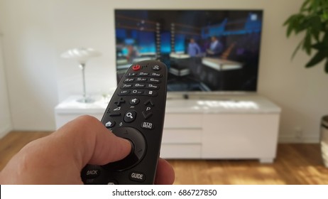 Hand Holding Remote Control