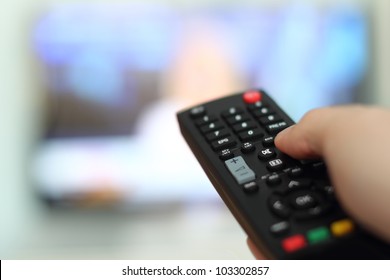 Hand Holding Remote Control Of A Television