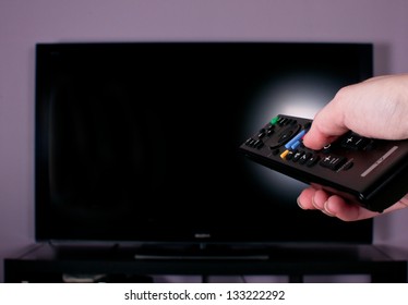 Hand Holding Remote Control For Turn Off TV