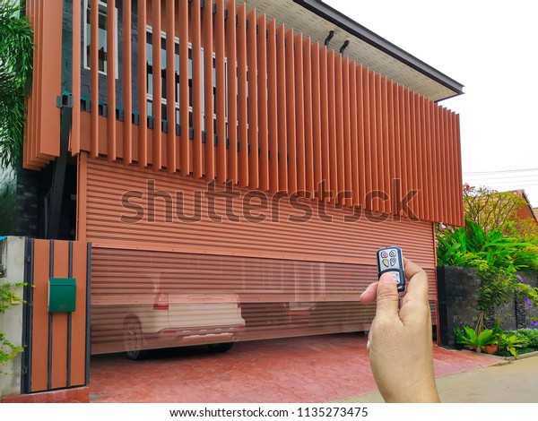 Hand Holding Remote Open Sliding Door Stock Photo Edit Now