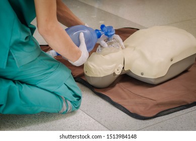 Hand Holding A Resuscitation Bag, ,Medical Team Help People Who Are Not Breathing With Ambu Bag,silicone Mask,CPR Cardiopulmonary Resuscitation Process, Nurse Use Ambu Bag For Ventilation To Patient,