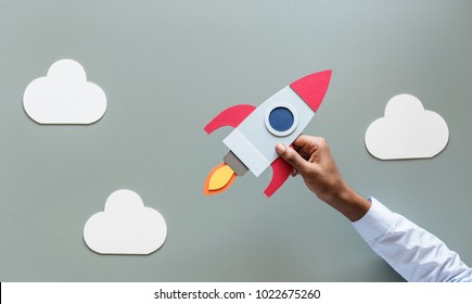 Hand Holding Rocketship Startup Business