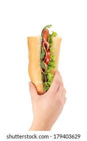 Hand Holding Sandwich With Ham And Tomato Slices. Isolated On A White Background.