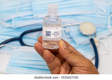 Hand Holding Hand Sanitizer Gel With Barcode (fake Barcode).