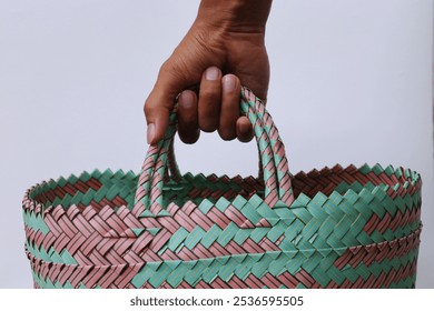 Hand holding shopping bag on white background - Powered by Shutterstock