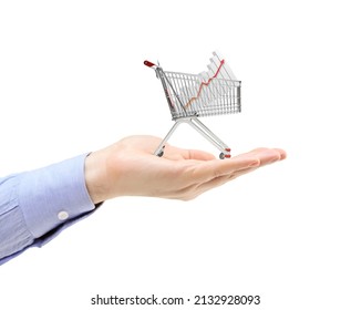 Hand Holding A Shopping Cart With A Bar Chart Inside Isolated On White Background