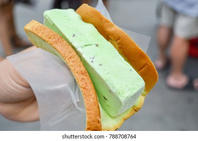 Hand Holding A Singaporean Ice Cream Sandwich