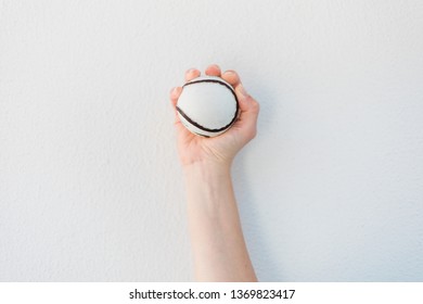 Hand Holding A Sliotar