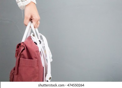 Hand Holding Small Bag