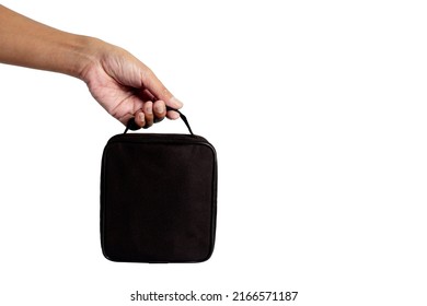 Hand Holding Small Black Bag Isolated On White Background.