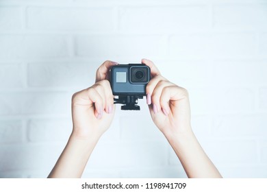 Hand holding small camera 