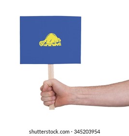 Hand Holding Small Card, Isolated On White - Flag Of Oregon