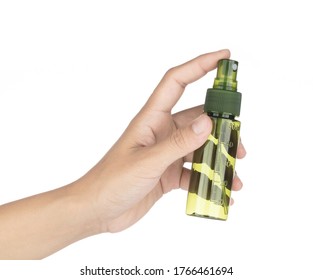 Hand Holding Small Spray Bottle Isolated On White Background