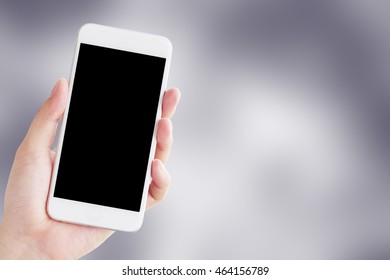 Hand holding smartphone, Abstract color blue background
