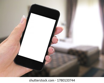 Hand holding a smartphone with a blank screen - Shutterstock ID 1780133744