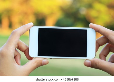 Hand Holding Smartphone With Blank Screen