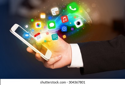 Hand holding smartphone with colorful app icons concept