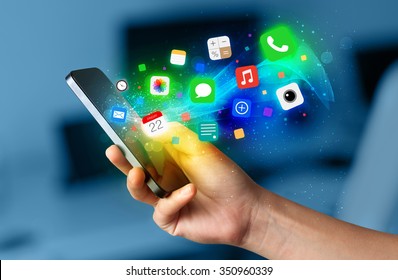 Hand holding smartphone with colorful app icons concept