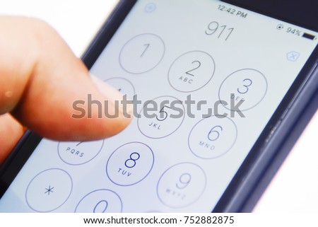 Hand Holding Smartphone With Emergency Number 911 On The Screen