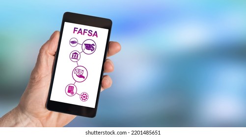 Hand Holding A Smartphone With Fafsa Concept