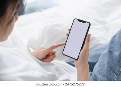 Hand holding smartphone mockup of blank screen for graphic display montage. - Powered by Shutterstock