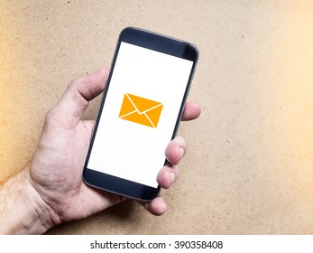 Hand Holding Smartphone Mockup With Message Icon On Screen. Email