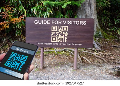 Hand Holding Smartphone With Scanning QR Code Travel Guide Screen With Guide For Visitors Sign, Smart Technology Concept And Qr Code Idea