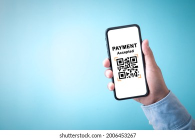 Hand holding smartphone sceen with application online payment, moblie phone business shopping online and blue background. - Powered by Shutterstock - Get 15% off with code: PIKWIZARD15
