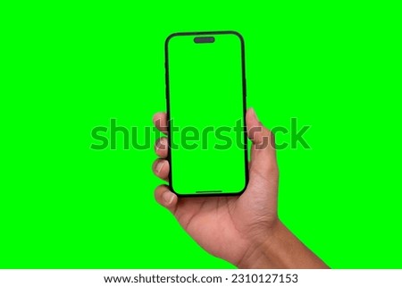Hand holding smartphone set with green screen for VDO editer and modern frameless design in two rotated perspective positions - isolated and Clipping Path
