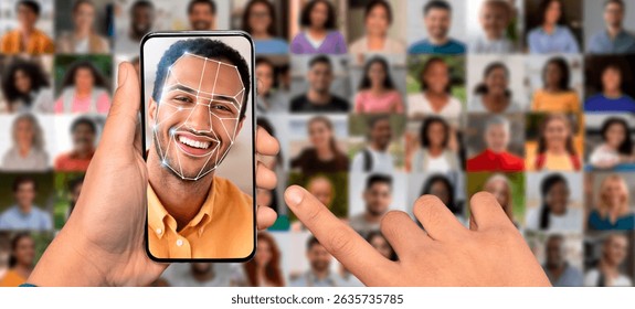 Hand holding smartphone showing face recognition technology for identification