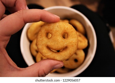 Hand Holding Smiley Fries