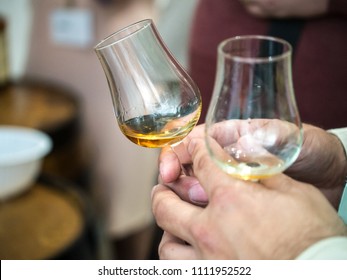 Hand Holding A Snifter Glass Filled With Whisky, Whisky Tasting Event