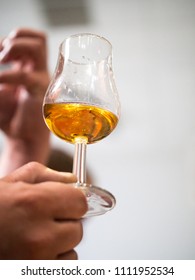 Hand Holding A Snifter Glass Filled With Whisky, Whisky Tasting Event