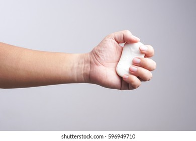 Hand Holding Soap Bar On White Background