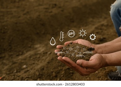 Hand holding soil with virtual interface displaying crucial data on nutrients, temperature, pH and moisture