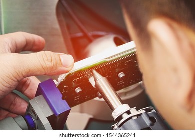 hand holding soldering tools in analysis lab - Shutterstock ID 1544365241