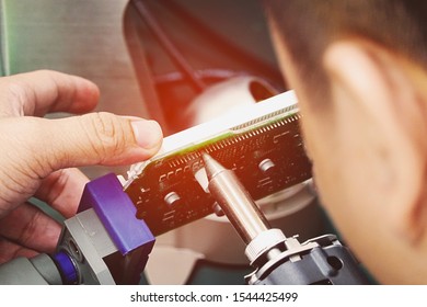 hand holding soldering tools in analysis lab - Shutterstock ID 1544425499