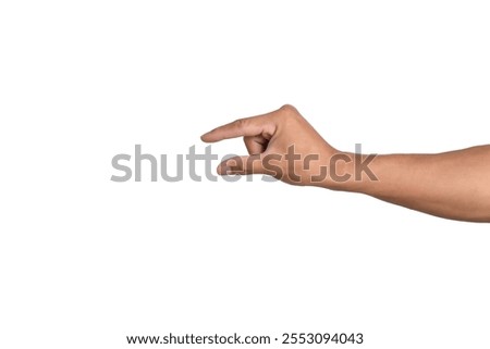 Hand holding something small between two fingers, isolated on white background.
